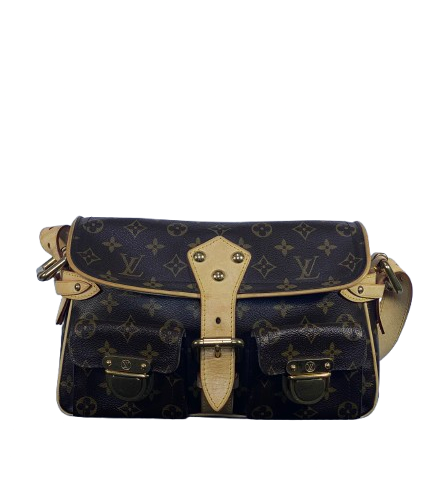 Designer handbag with monogram pattern on a white background